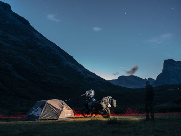 Norway night camp with tent and motorcycle